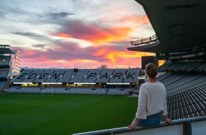 A person overlooking Eden Park Stadium from the bleachers.